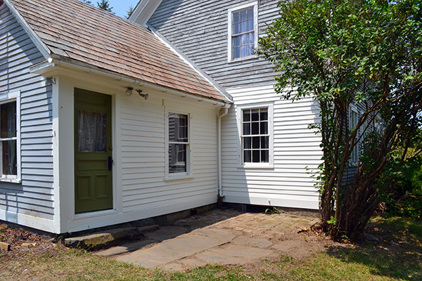 Painted House Exterior Patio Area With A Green Door