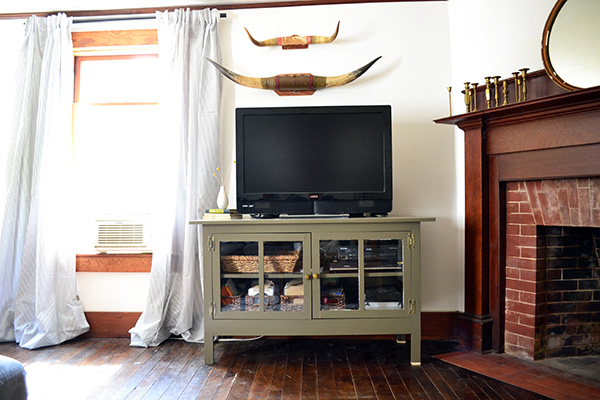 Muddy Green Painted Media Cabinet In A Living Room