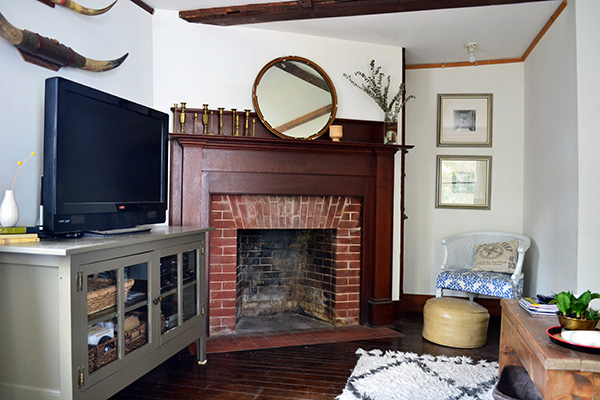 Muddy Green Painted Media Cabinet In A Living Room