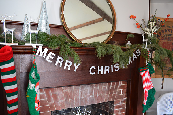 Merry Christmas Garland On A Mantle