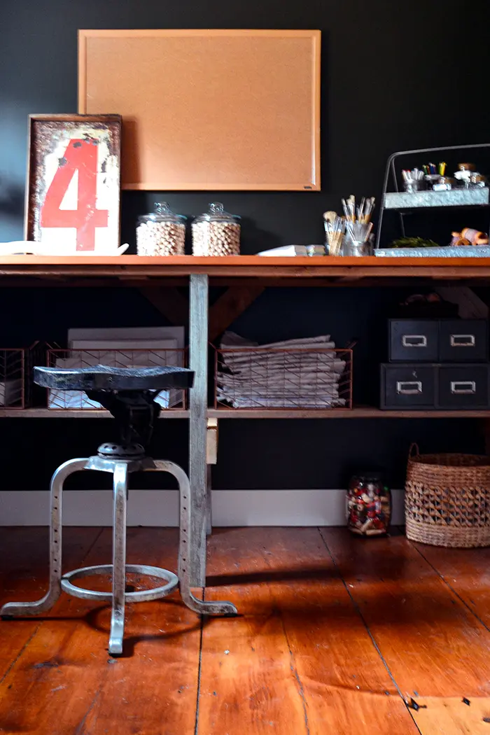 Craft room table built from recycled barn wood found on the farmhouse property