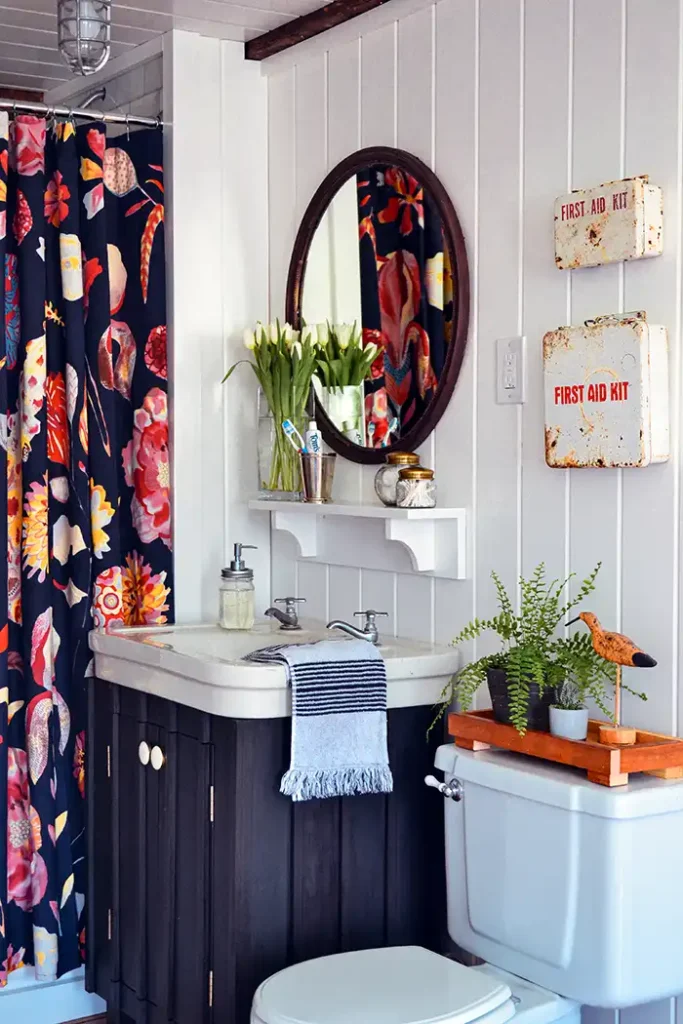 Guest bathroom renovation reveal featured image with white planked walls and a bold shower curtain