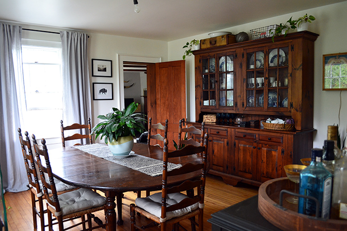 Farmhouse renovation progress in the dining room with wood hutch