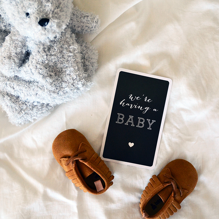 Expecting baby campbell in February 2017 with stuffed animal and baby moccasins