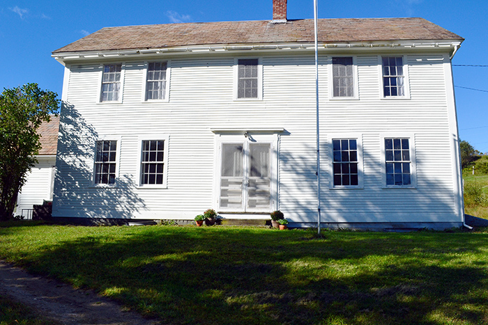 White colonial farmhouse in Vermont