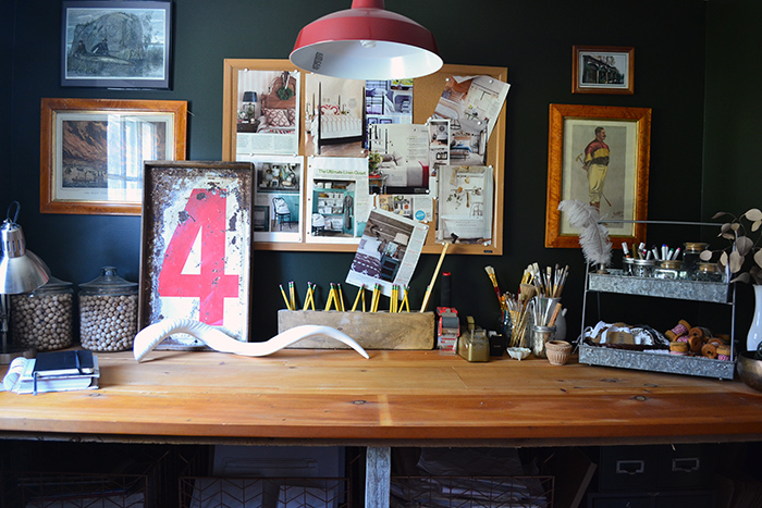 A rustic wood craft room work bench