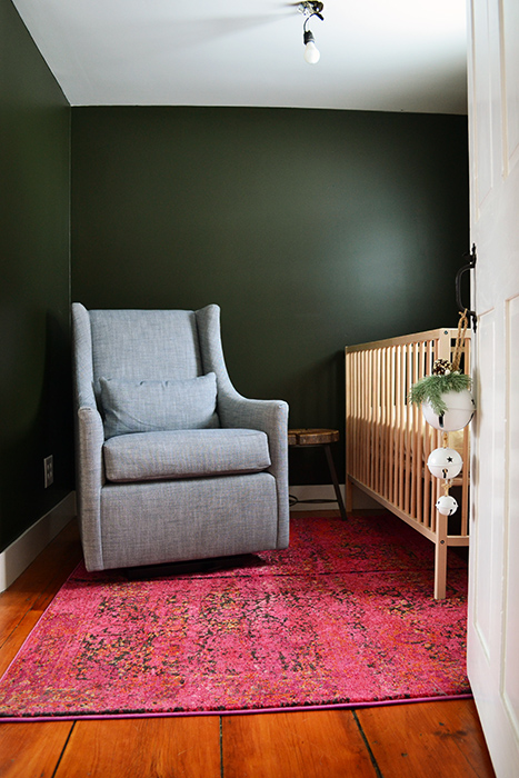 Duct taping two rugs together to make a just the right size pink rug for a nursery