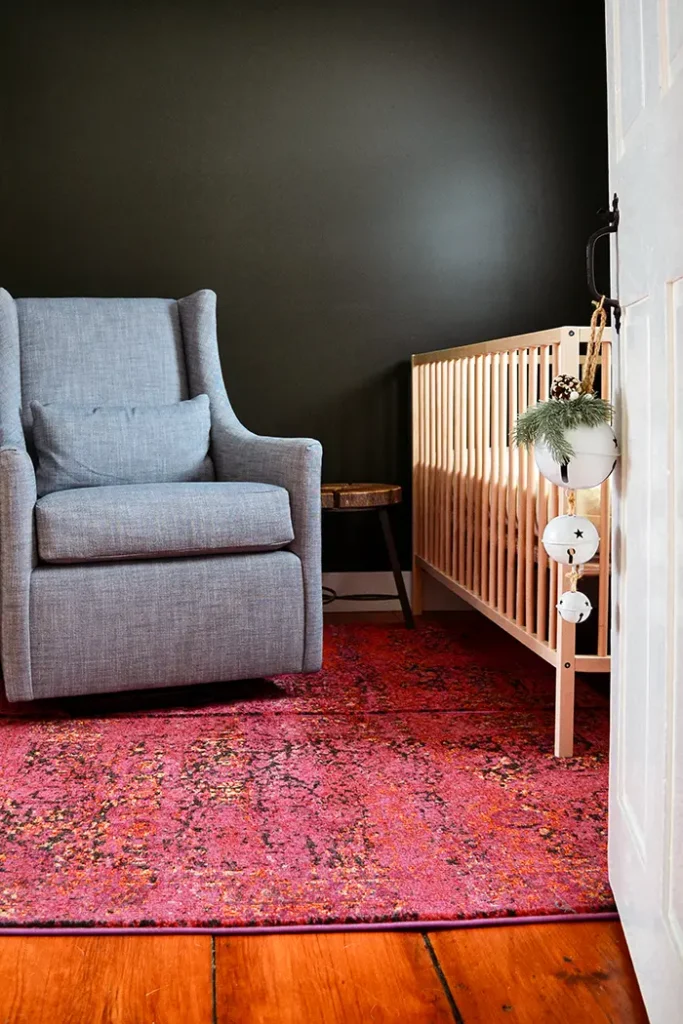 Duct taping two rugs together to make a just the right size pink rug for a nursery