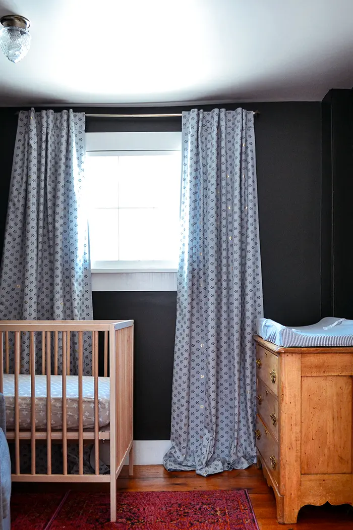 Adding budget friendly nursery lights to balance a splurge on Anthropologie curtains in a small nursery