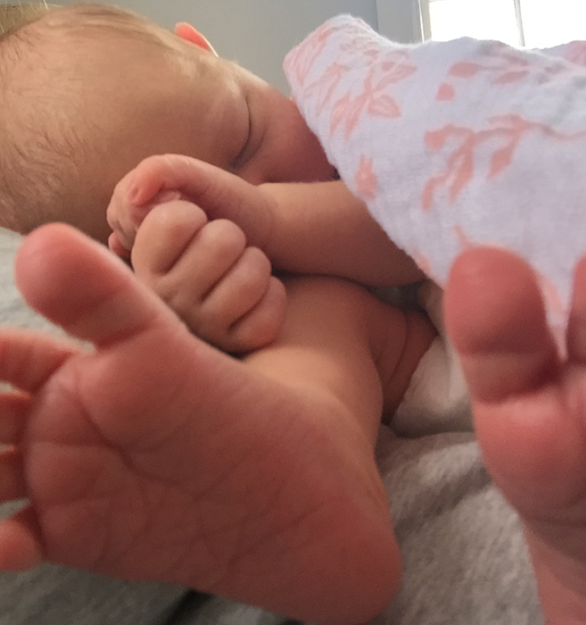 Snuggly newborn baby feet, toes and hands