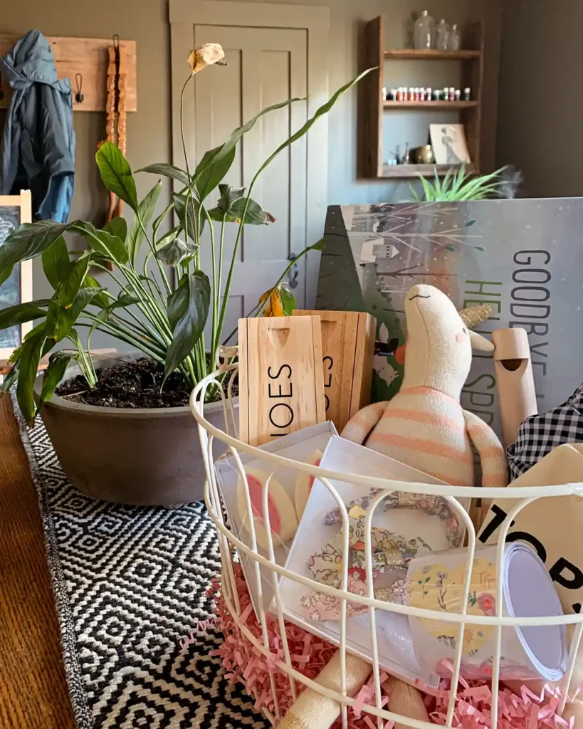 Minimalist Easter Basket ideas for a child like this that includes books, games, hair clips, stuffed animal, bathing suit, stickers and other things kids either need or consume