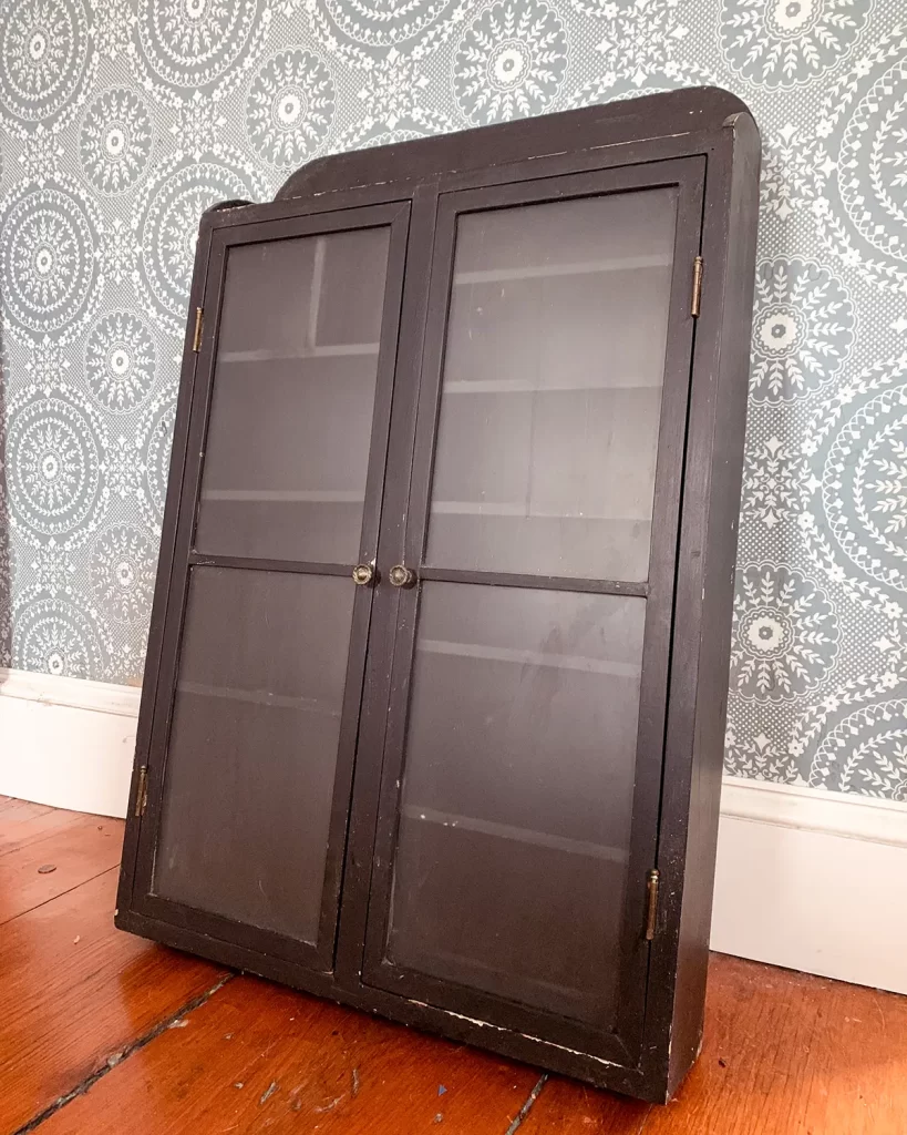 Vintage black bathroom cabinet found at a flea market for the bathroom renovation project