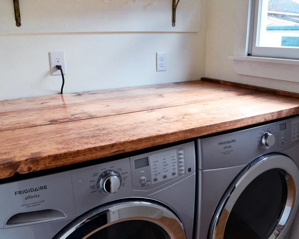 Removable laundry countertop DIY project to create a folding area in a small laundry room