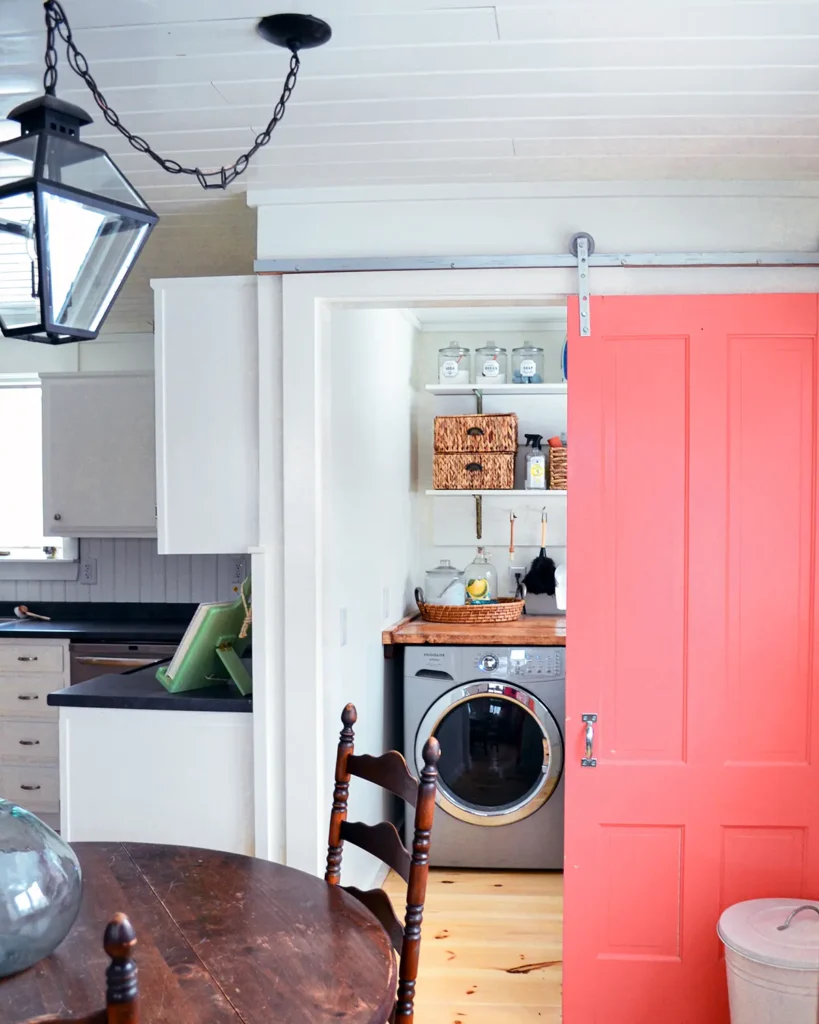 Small laundry room makeover with DIY shelves for organizing laundry and cleaning supplies