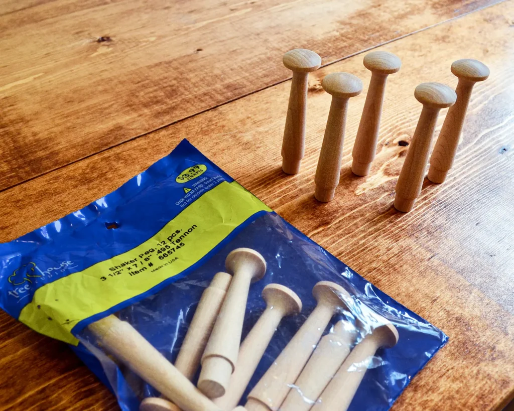 Unfinished shaker pegs for adding functionality to laundry room shelves