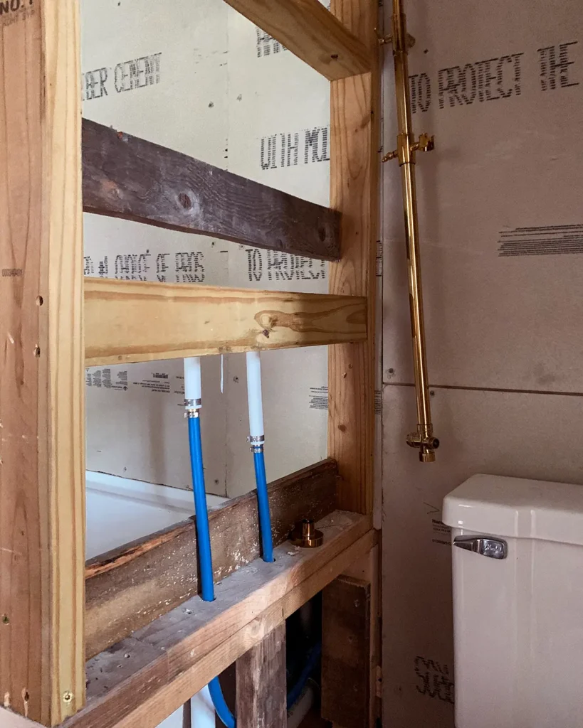 Moving Pex plumbing from an exterior wall to a newly framed shower wall