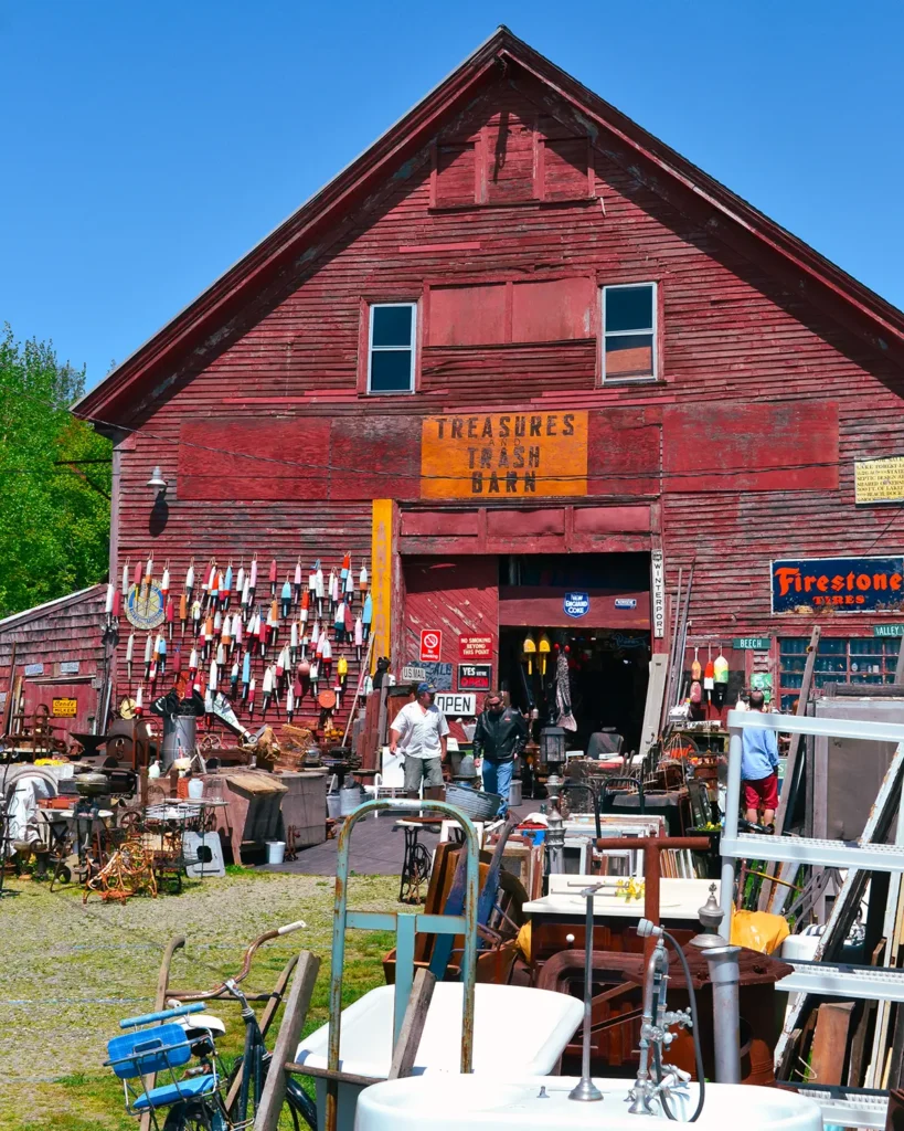 Shopping Maine flea markets including this flea market sprawling from an old, big red barn in the Belfast area of Maine