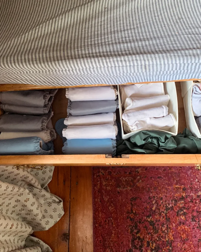 Nursery organization of a diaper drawer, the top drawer of a dresser turned changing table