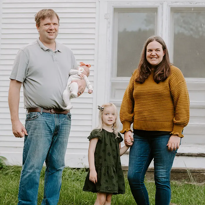 Angie's Roost Campbell Family in front of home in 2021