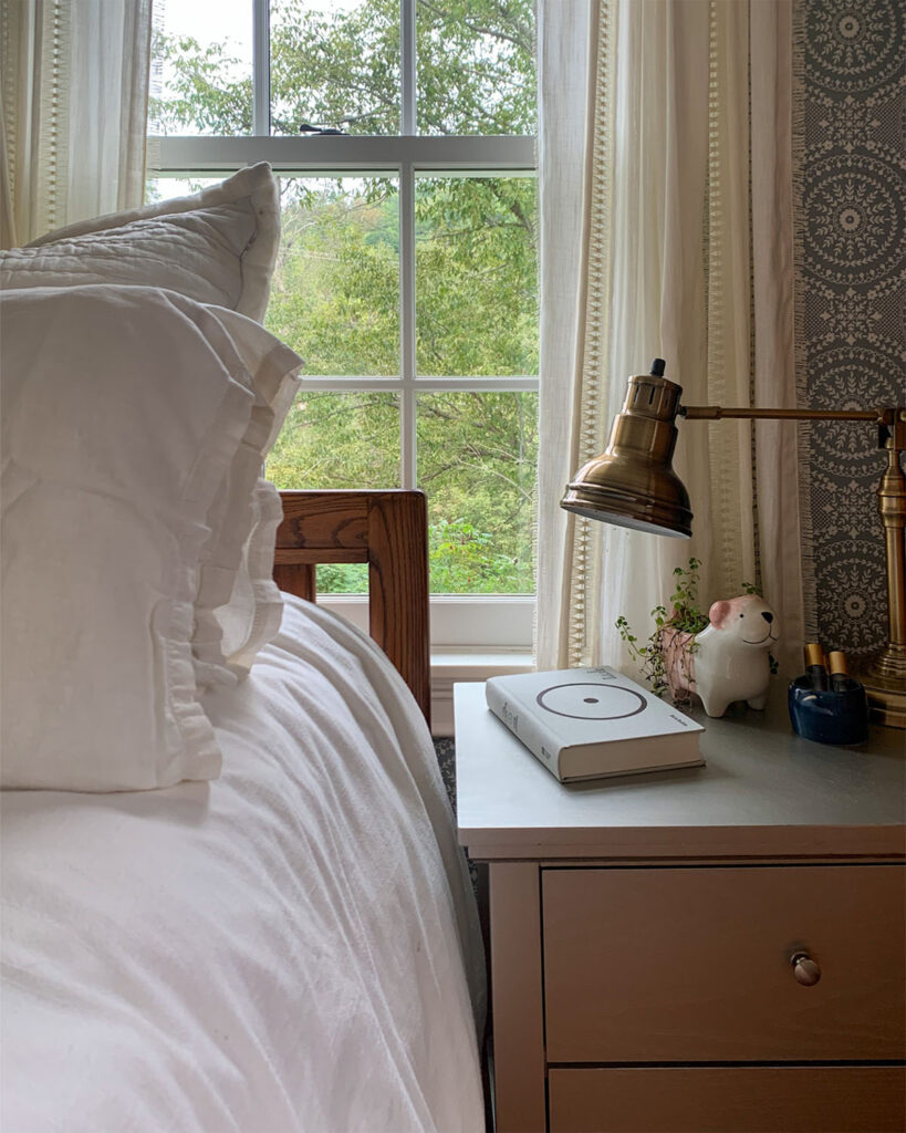 Bedside table before bedroom refresh needs fresh paint and styling