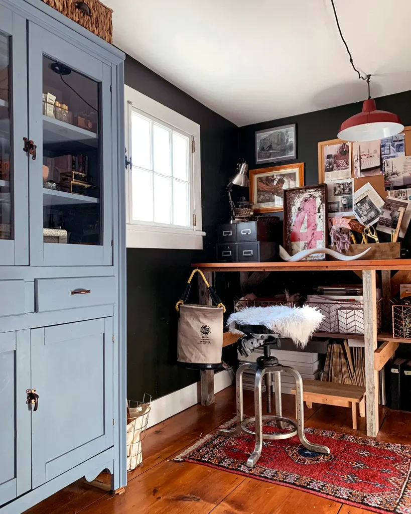 Vintage cabinet furniture piece in craft room chalk painted Annie Sloan Louis Blue to give natural wood a new look