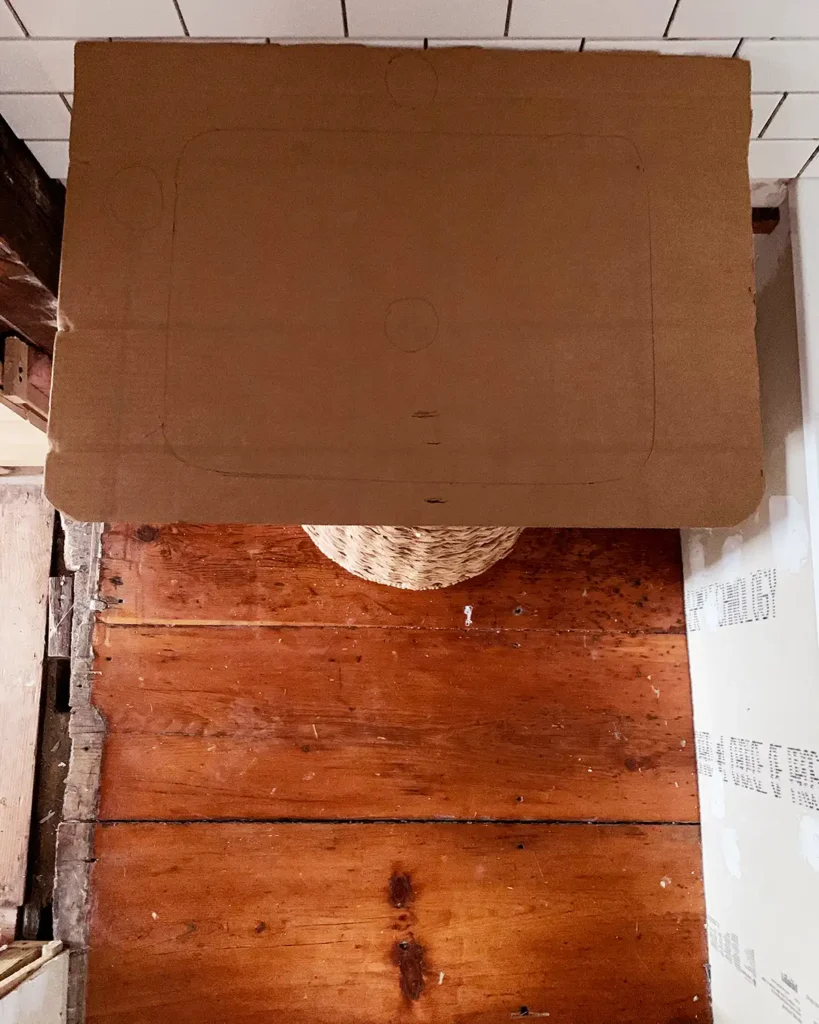 Cardboard vanity top template to test the size of the vanity and how much it obstructs the closet doorway