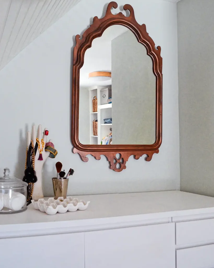 White chalk paint on a piece of laminate furniture from Ikea with a vintage mirror hanging above it