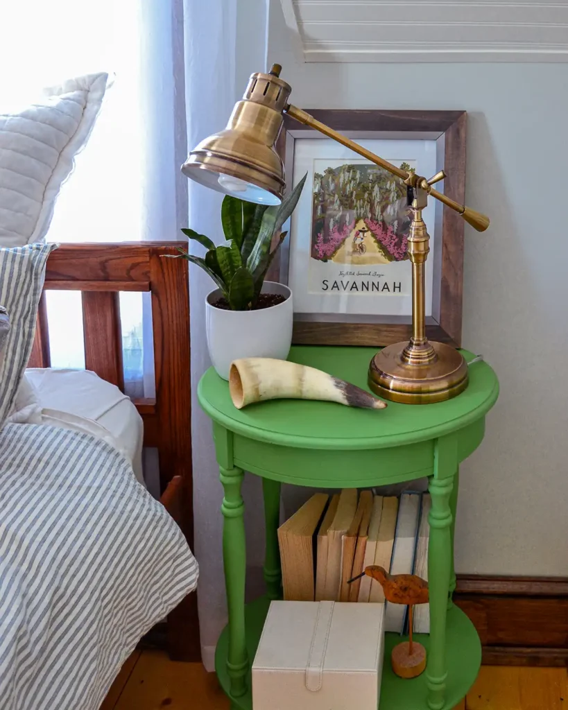 Chalk paint comes in a wide variety of colors like this nightstand painted Annie Sloan Antibes Green to bring a bold color into a neutral bedroom