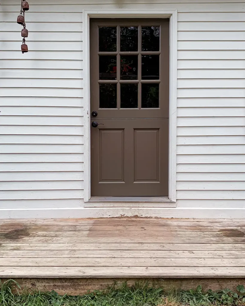 Clearing the porch of all flowers and decor to reset it for fall porch decor