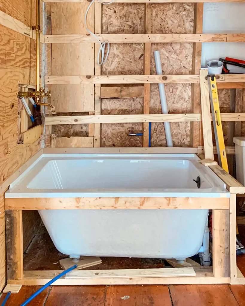 Small compact tub with a long lead time framed in a small bathroom makeover, the part that slowed down our bathroom remodel schedule.