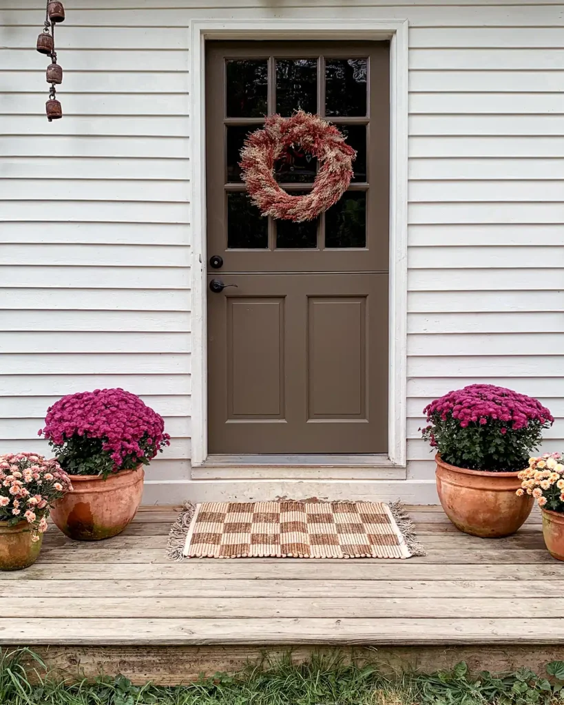 Pink mums on a front porch for fall decorating