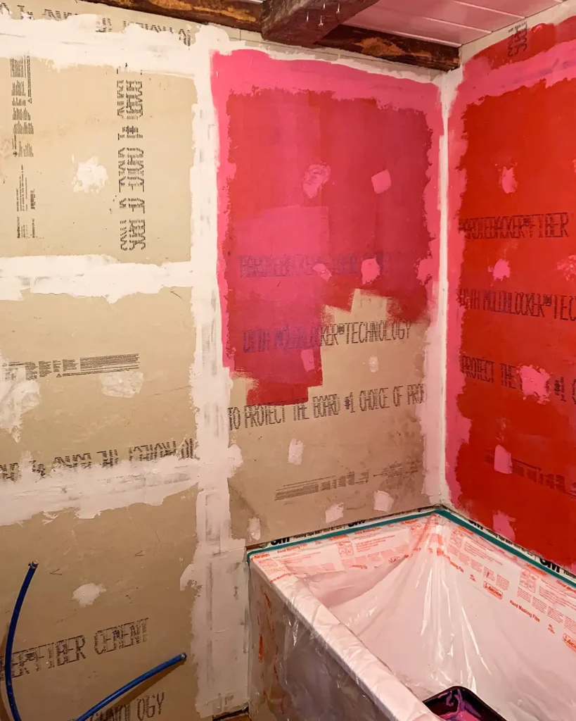 How to Waterproof Bathtub and Shower Walls with Redgard - DIY Danielle®