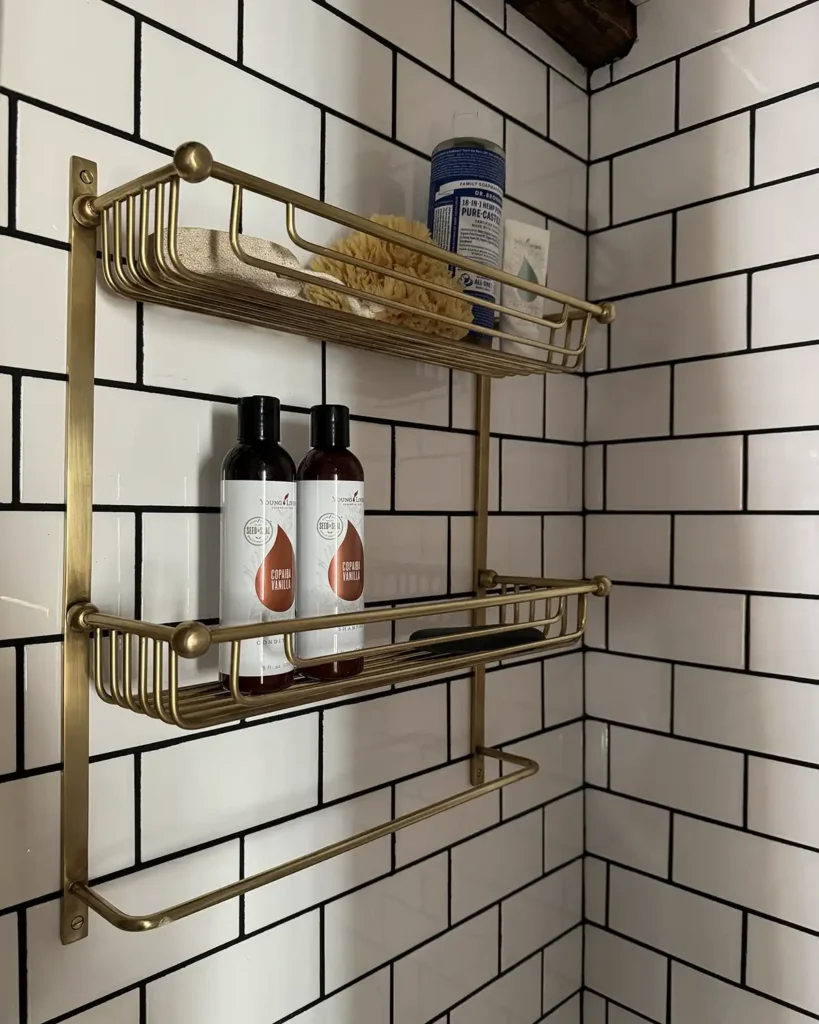 https://www.angiesroost.com/wp-content/uploads/2023/11/Brushed-Gold-Shower-Shelf-819x1024.webp