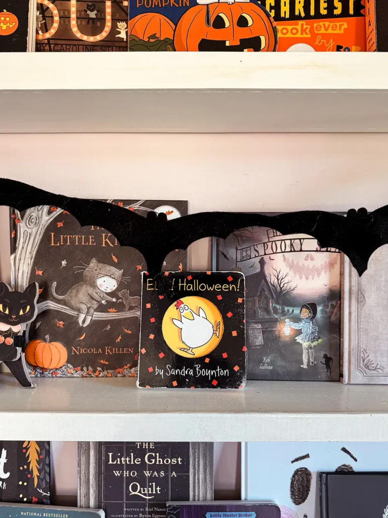 "Eek! Halloween!" board book on a kid's bookshelf