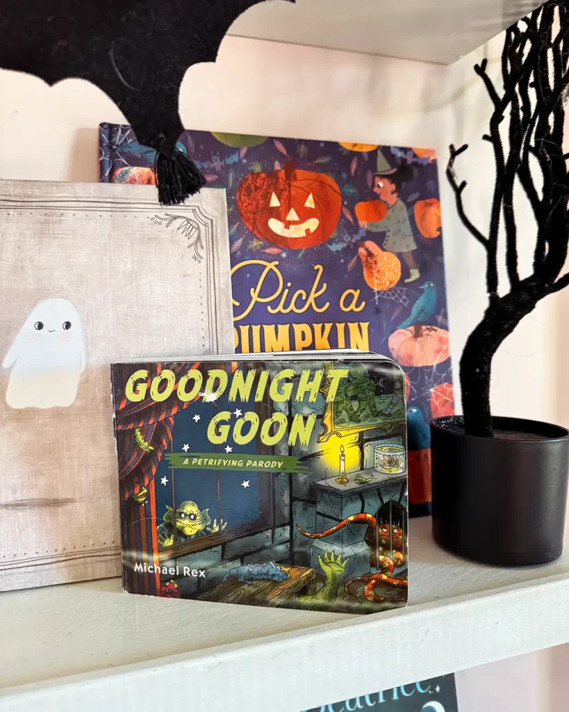 "Goodnight Goon" board book on a kid's halloween bookshelf