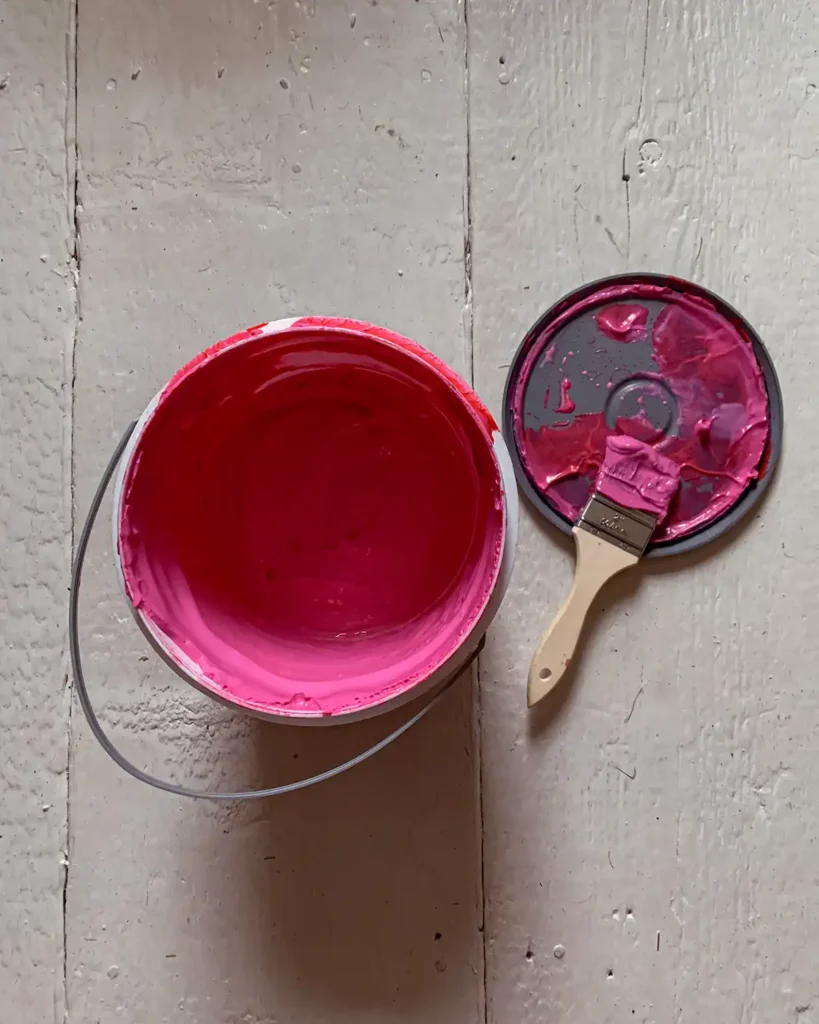 RedGard liquid waterproofing membranes starts off pink and dries to red, it's like pink slime in the bucket