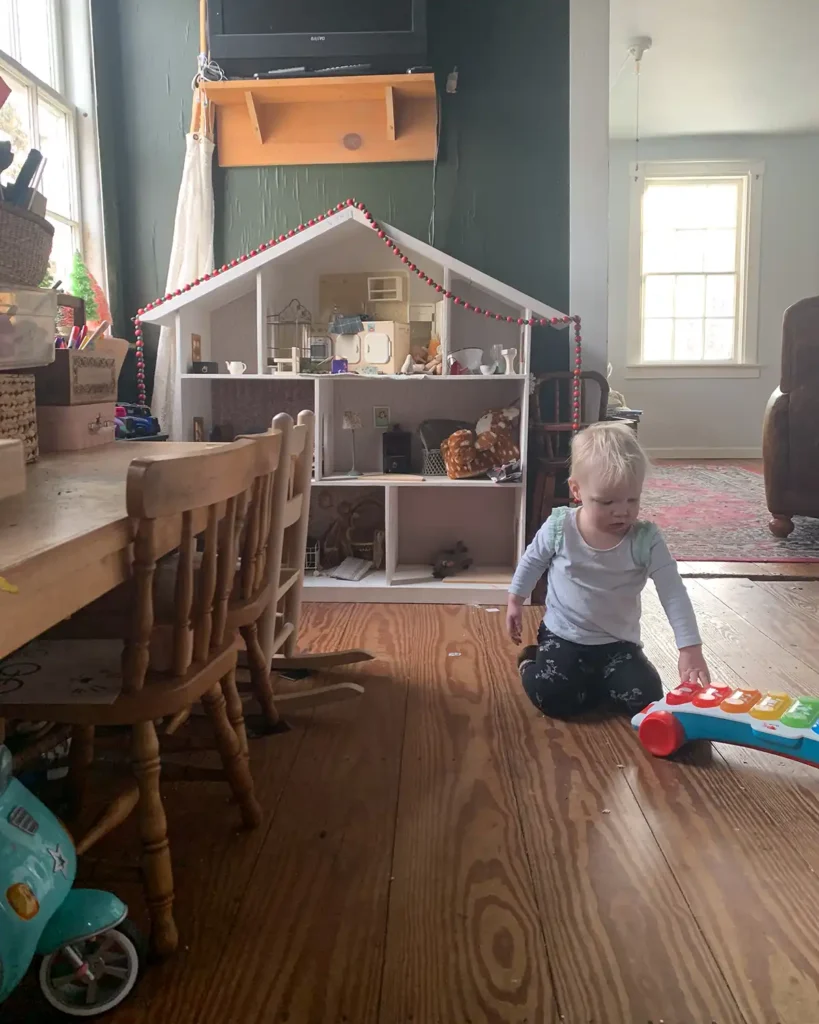 Third bedroom space currently used as a playroom/laundry room/storage room