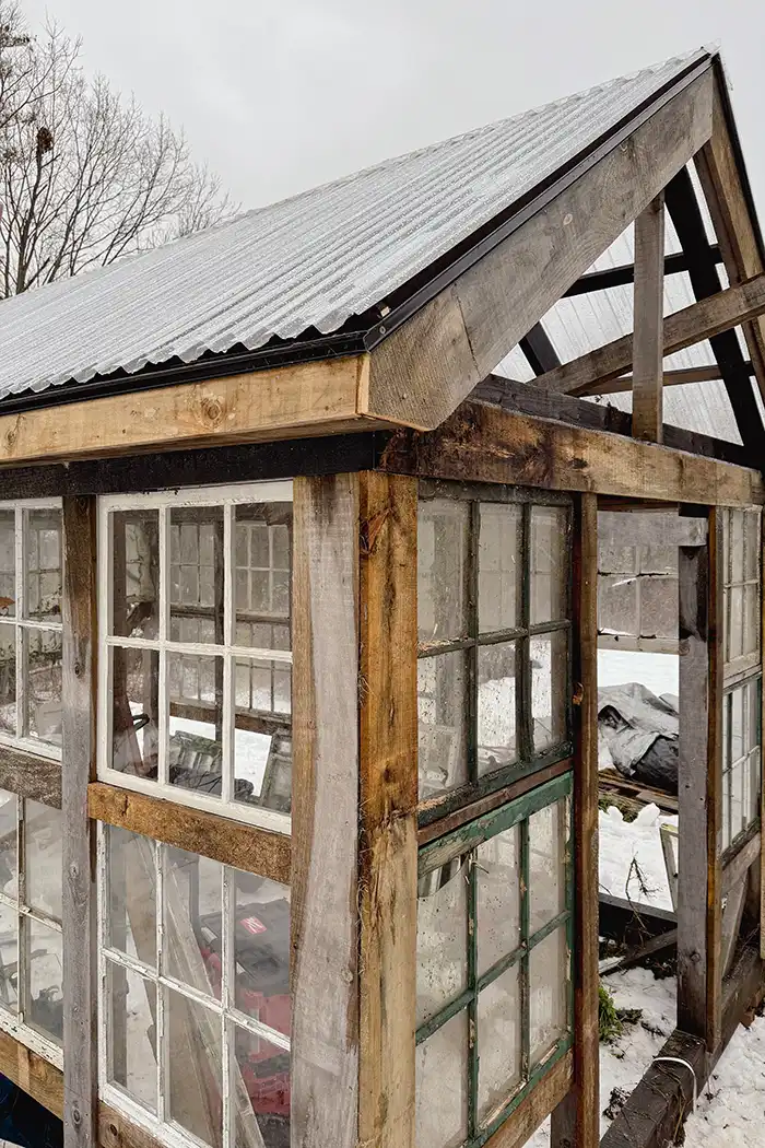 Greenhouse building progress in January featured image with roof installed and window sash mostly in