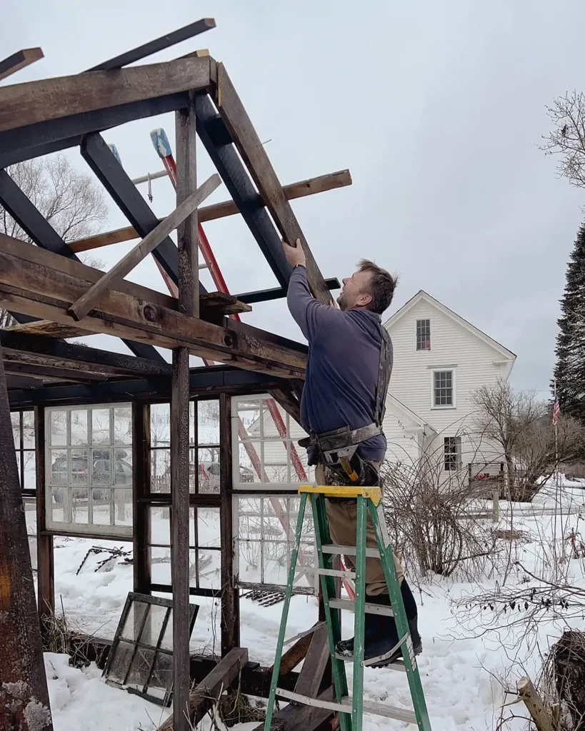 Greenhouse building progress working on the greenhouse roof and framing