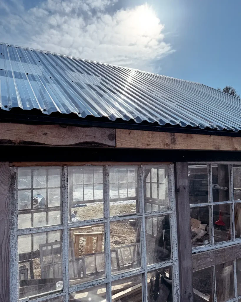 How to install polycarbonate roofing, specifically these corrugated roofing panels, on a framed greenhouse structure