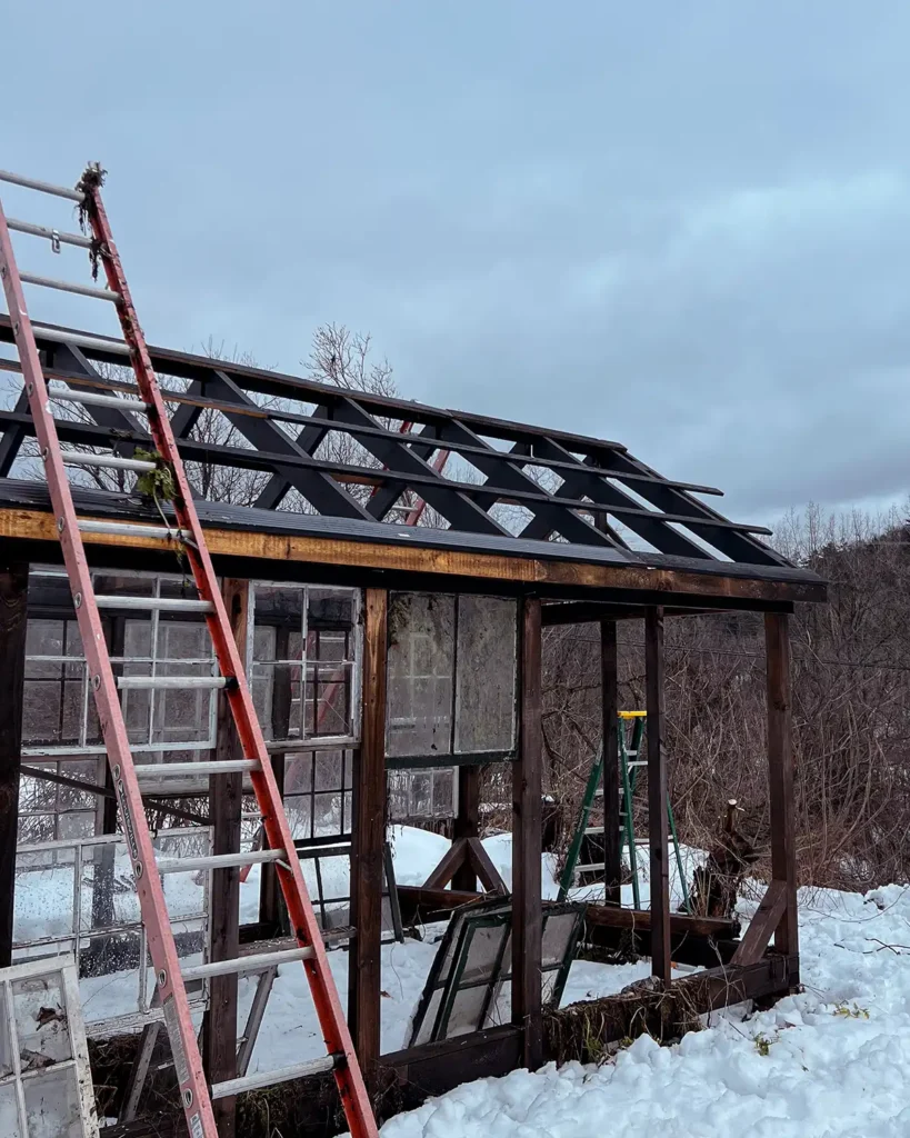 Installing the purlins to prep the greenhouse framing a structure to install polycarbonate panels