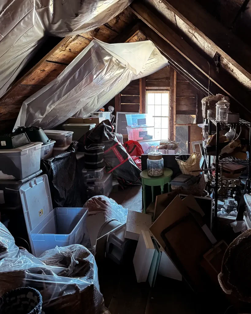 Cluttered attic before sorting through and decluttering the items