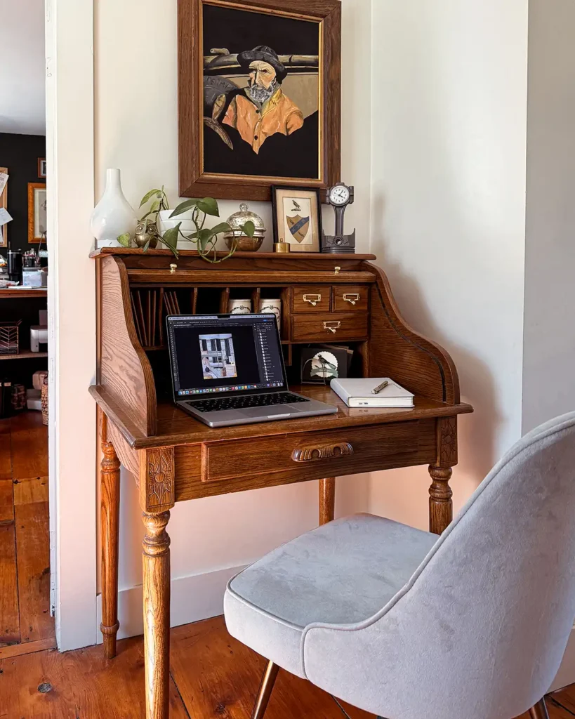Working at a small roll top desk