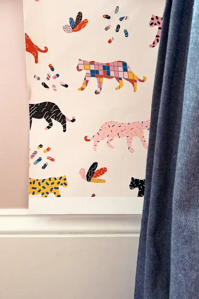 The final decision for the girls bedroom wallpaper ended up being this jungle wallpaper with jungle cats of varying colors and patterns on a white background