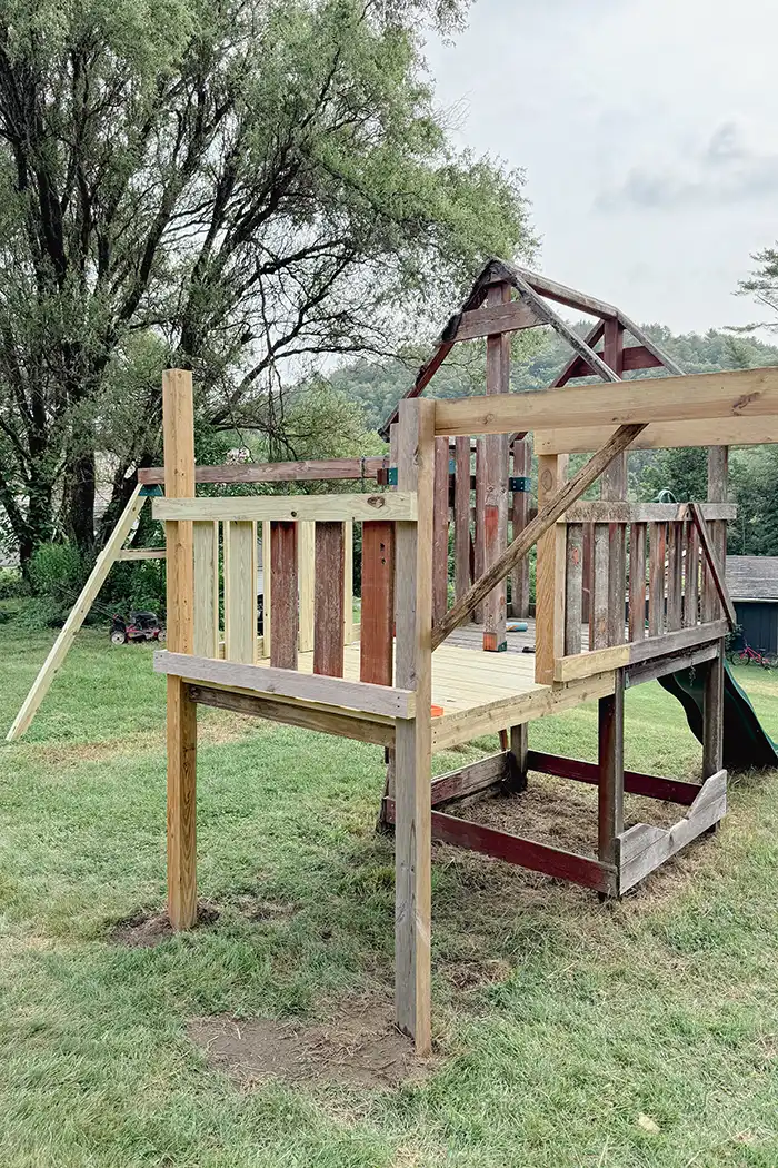 Playground renovation update for week 1 featured image with a playground deck extension finished, monkey bars framed, and rotten wood replaced