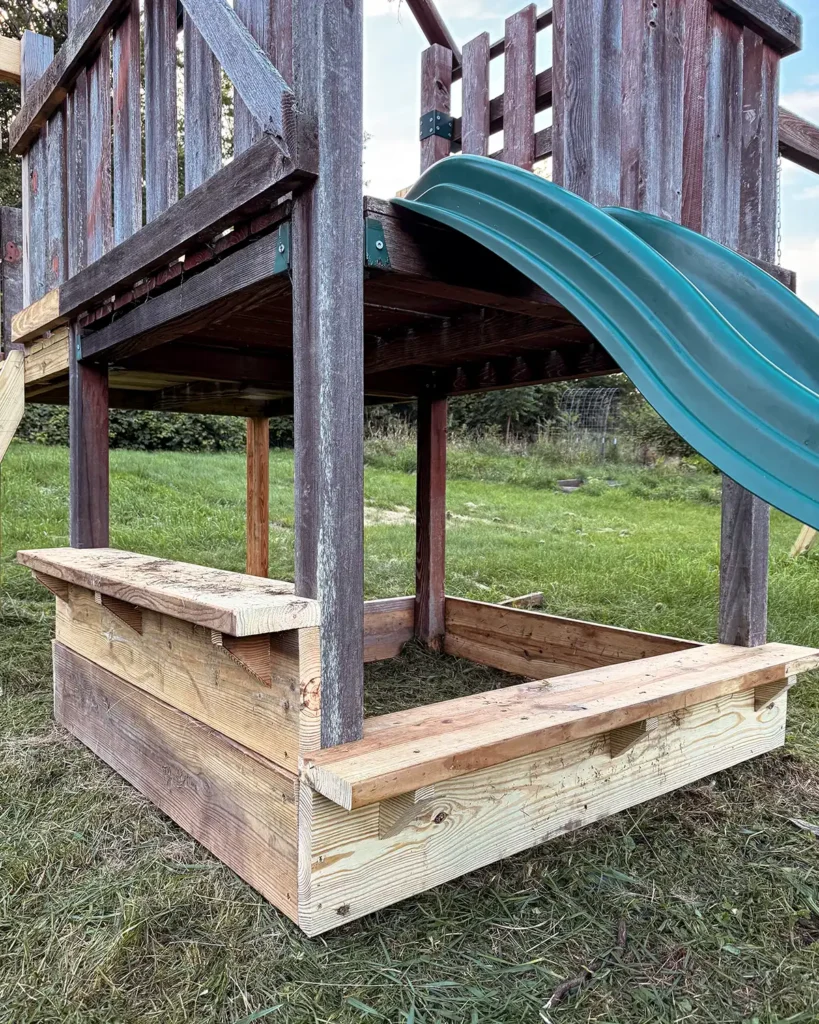 Building progress for the sandbox underneath a playground structure, building a small bench and a serving bar area