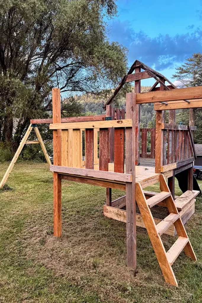 Playground update week 2 featured image with an old playground getting a makeover with an extended deck, monkey bars, and ladder