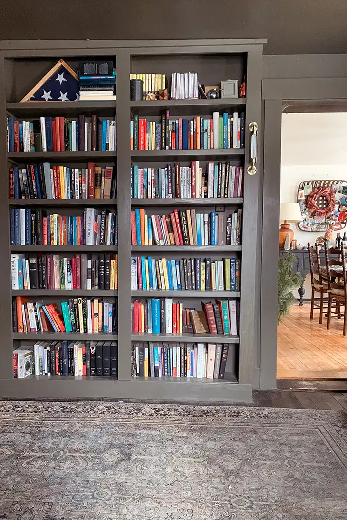 State of the house address 2024 featured image with dark green built in bookcases filled with books