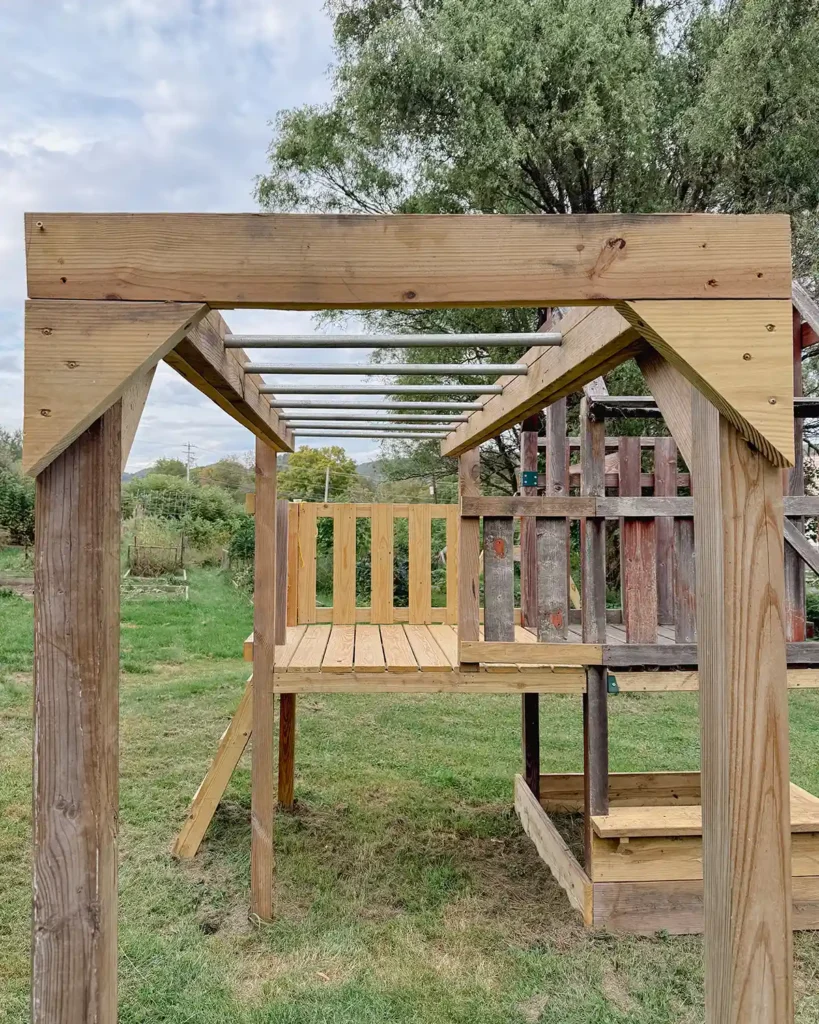 Wooden monkey bar bracing added to the top of the monkey bars to keep the framing from twisting