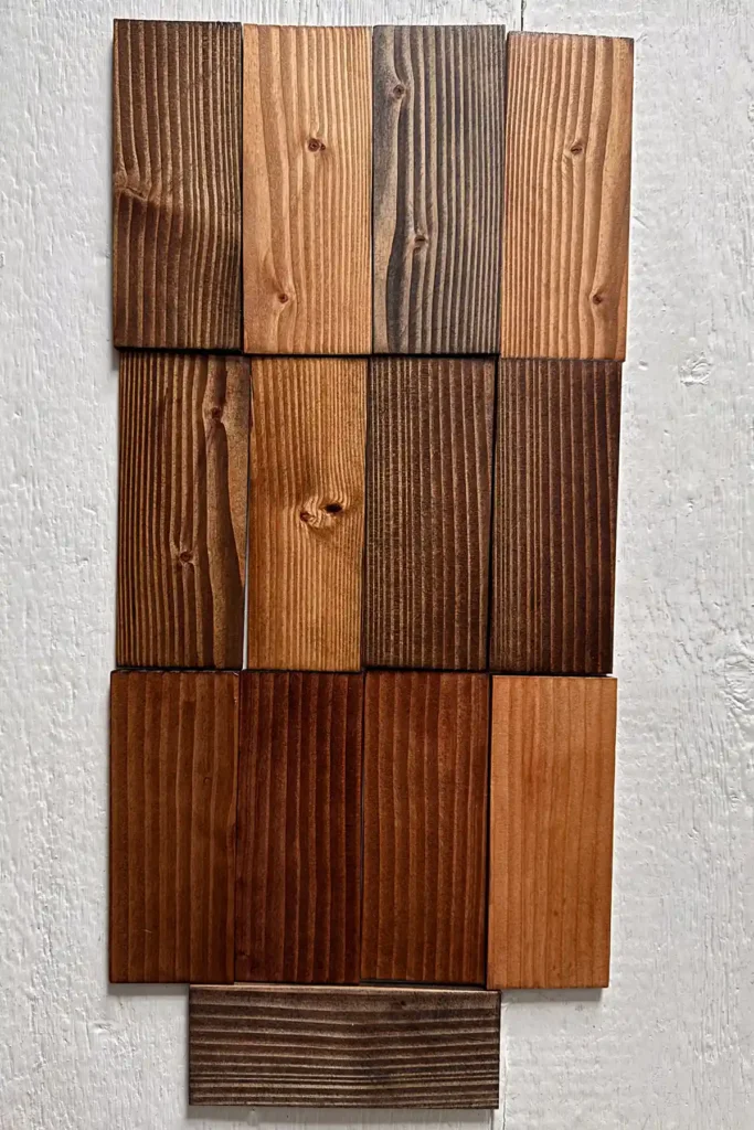 Testing all of the dark Minwax stains on samples of douglas fir wood; colors include Dark Walnut, Early American, Ebony, English Chestnut, Espresso, Honey, Jacobean, Mocha, Provincial, Red Mahogany, Red Oak, Special Walnut, and True Black